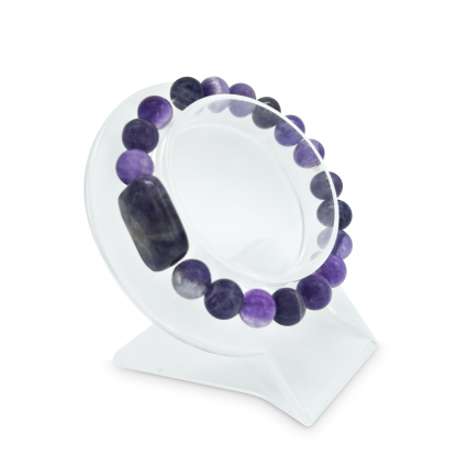 Angled view of Amethyst Crystal Energy Bracelet displayed on a clear stand